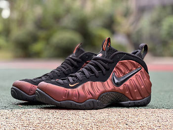 orange and black nike foams